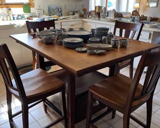 Nice high top table with six chairs and extends with 2 leafs