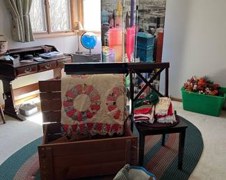 We have two old quilts, trunk with lid, double sided screen room divider, desk