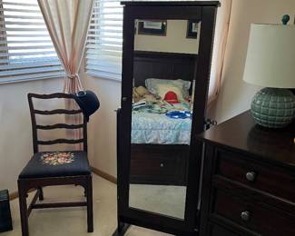 The standing mirror is a jewelry box