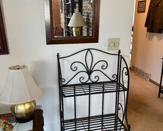 Folding metal stand and a mirror