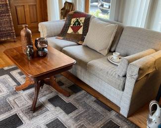 Sofa, antique table, pottery, rug