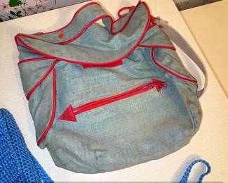 Vintage Denim Backpack with Red Trim and Arrow Zipper Pull