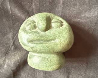 Green Stone Carving of a Face with Runes