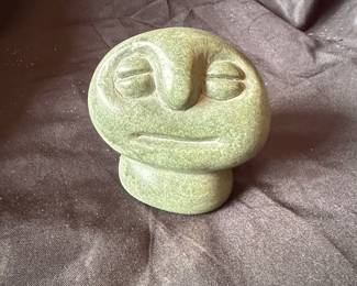 Green Stone Carving of a Face with Runes second image