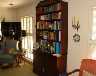 Antique bookcase and upholstered chairs