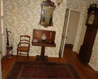 Antique folding card Empire period table, oriental carpet and English tall clock