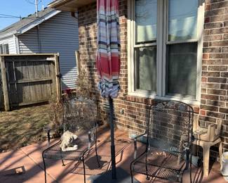 Two metal patio chairs 