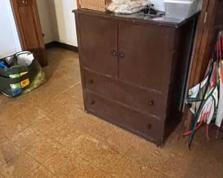 Cabinet with interior drawers on top left side