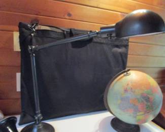 Art portfolio bag complete with art supplies, lamp, globe
