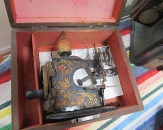 Antique child's sewing machine in original box