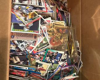 Box of early 90’s basketball and football cards