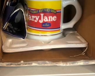 Several Cirner Store advertising mugs