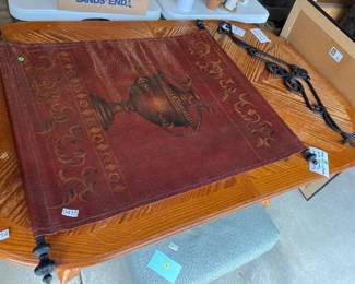 PAINTED LEATHER TAPESTRY WITH WROUGHT IRON HANGER