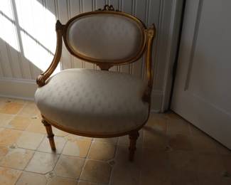 Louis XVI Style Low Upholstered Salon Chair with an oval padded back and a broad oval seat