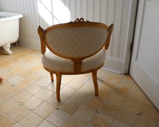 Louis XVI Style Low Upholstered Salon Chair with an oval padded back and a broad oval seat