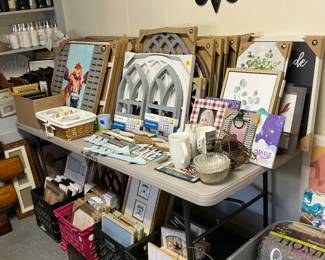 Tables and crates full of wall art