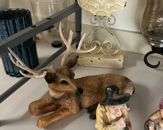 Cute buck laying down old man and woman home decor