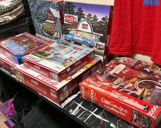 Big collection of Coca-Cola puzzles, some brand new