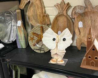 Carved wooden serving pieces, seahorse, pineapple, turtle owl made of Shells