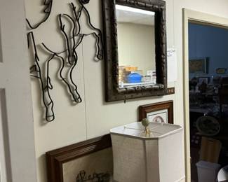 A horse cut out of iron beveled mirror