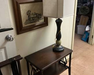 A print of a steam engine, brass lamp side table