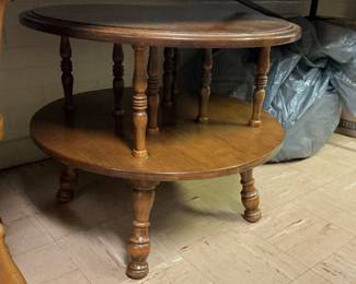 Several round maple, two-tier tables