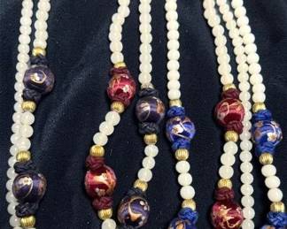 Four Strands of Beads With Some Silk Wrap Beads