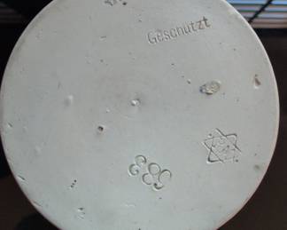 Collection of Three German Beer Steins: Relief Ceramic, Pewter-Lidded Embossed, and Cartoon-Style Ceramic