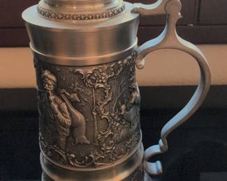 Repurposed Metal Art Tractor Sculpture and Assorted German Beer Steins