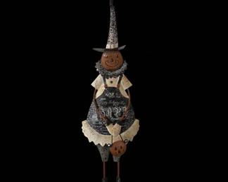 Halloween Witch Figurine with Pumpkin Accents and "Happy Halloween" Apron