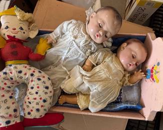 Vintage Composition and Cloth Dolls in Bassinet