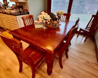 Dining table with 8 chairs and self storing leaf table measures 41"wide  x 73" long self storing leaf is 21" wide.  Table when fully extended is 94" long.