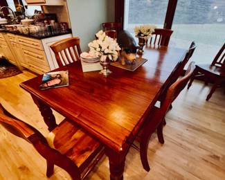 Dining table with 8 chairs and self storing leaf table measures 41"wide x 73" long self storing leaf is 21" wide. Table when fully extended is 94" long.