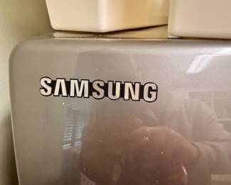 Samsung WF448AAP/XAA front-load clothes washer.. This model is known for its high capacity 