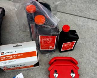 Additional goodie bag for the snow blower, spark plugs, oil etc