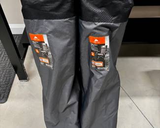 2 folding chairs with storage bags