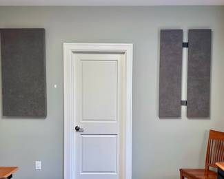 Acoustic wall panels from Acoustimac.  Panels have been removed and are available for purchase with hanging cleats.