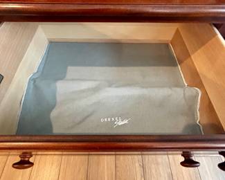 Flatware storage in lighted display cabinet