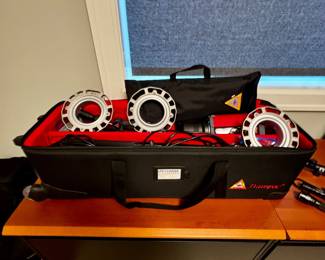 Portable photography or videography LED ring light kit, likely used for lighting subjects in studios or on location.  Kit includes led ring light units designed to provide even diffused light and case .