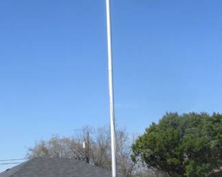 Aprox. 25 feet of flagpole, not set in concrete breaks down in about 6-foot sections.