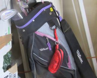 One of two sets of golf clubs and bag