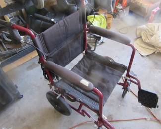 Small wheeled wheel chair.