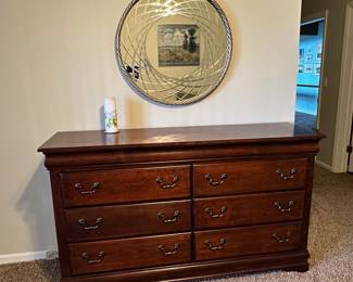 Italian designed silver gilded mirror with gilt wood frame.  Six drawer chest.