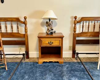 Bedroom with two twin American Drew Maple Colonial spindle headboard with mattress frames (no twin mattresses available).  Between them is a single American Drew  nightstand.