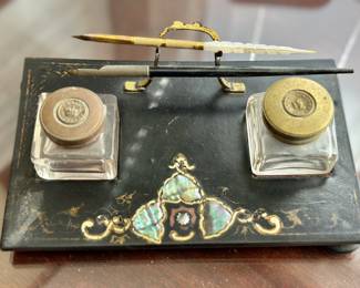 Black lacquer instand with mother of pearl inlay, two inkwells and pen holder.