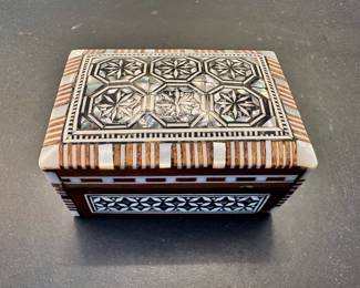 Wood trinket box with mother of pearl inlay.