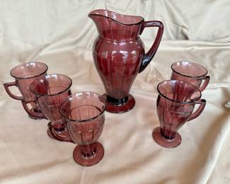 Hazel-Atlas "Newport Hairpin" amethyst glass pitcher and mugs.