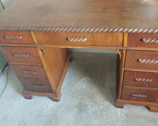 Vintage small wood desk with seven drawers. 48 x 24
