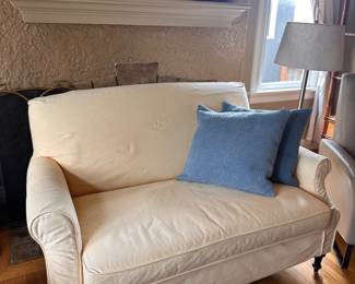 $260. Crate and Barrel pale yellow settee. Slip cover is machine washable. 57"w x 38"d x 36"h