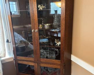 $840. Antique glass door corner cabinet. Approx. 42"w x 26"d x 83"h